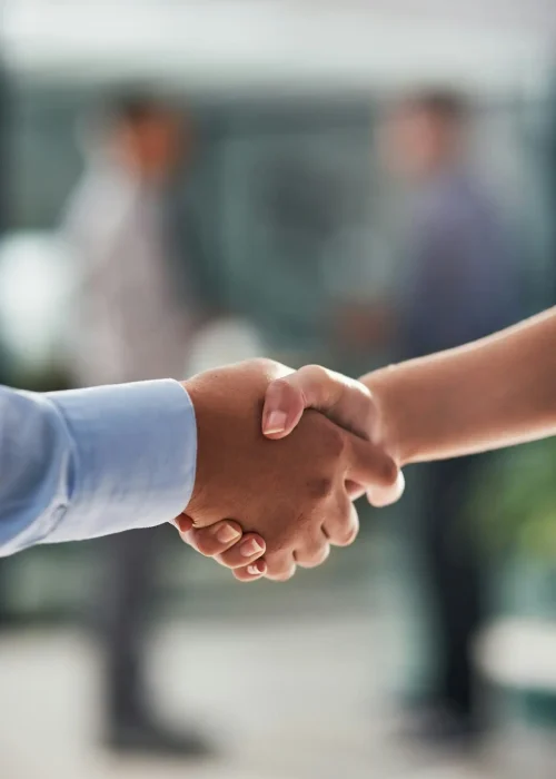 Sealing the deal with a handshake. Closeup shot of businesspeople shaking hands in an office.